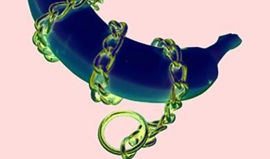 abstract image of banana wrapped in thick gold chain