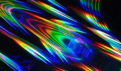 Colours in a pattern on a black background