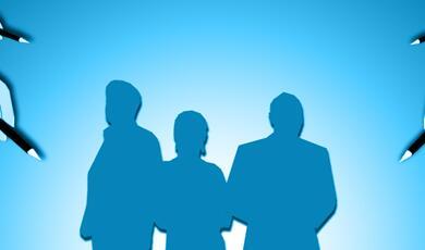 blue silhouette of 3 people, surrounded by hands bearing pencils