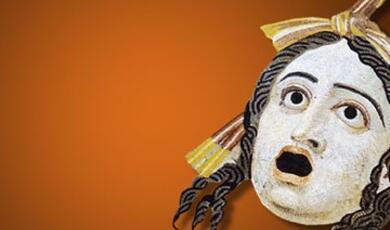 Greek theatre mask against orange background