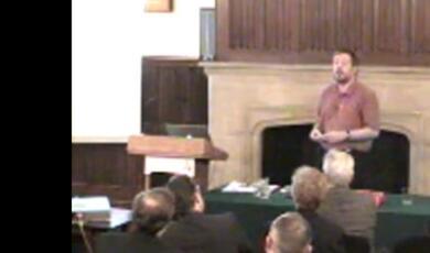 still of lecturer during event