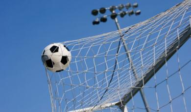 football in back of a net