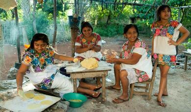 Family cooking together outside