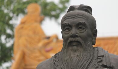 Close-up of face of statue of bearded Confucius