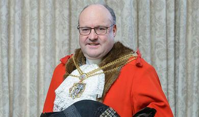 blue and green image, inside mechanism of a clock or watch