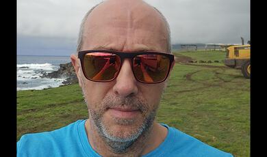 Hands holding a light bulb