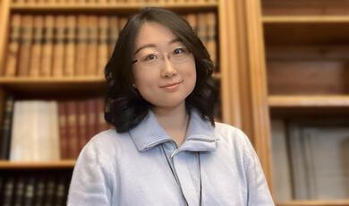 Hands holding a light bulb