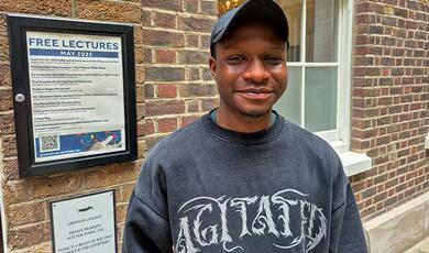 Hands holding a light bulb