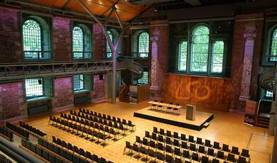 Exterior of LSO St Luke's showing hall and tower at night