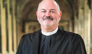 Hands holding a light bulb