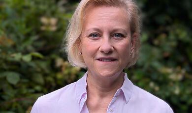 blue and green image, inside mechanism of a clock or watch