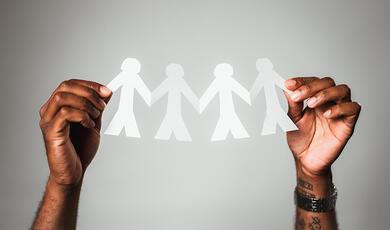 String of joined paper figures 