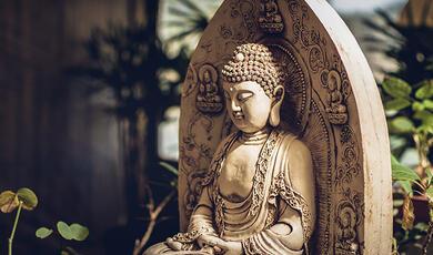 Buddha statue in garden setting