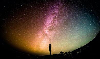 Man looking at a starry sky