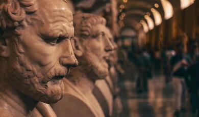 close up of row of faces and busts from antiquity