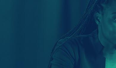 Black female speaker at lecturn