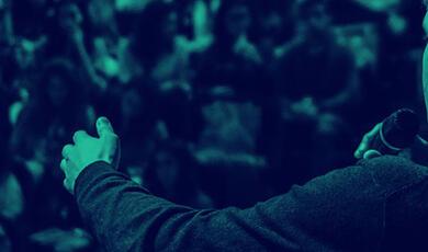 Speaker addressing large auditorium