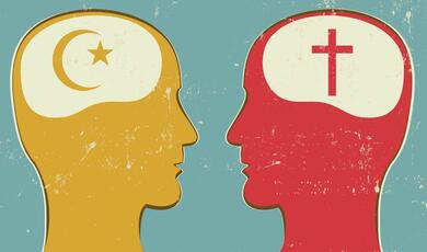 Cartoon of two heads facing each other one with a cross inside its brain and one with a crescent moon