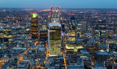 an arial shot of central London at dusk