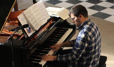 Photo of man playing piano