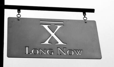 A sign showing the long now foundation logo