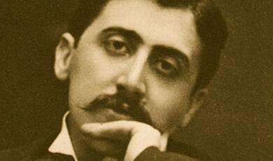 A black and white photograph of Marcel Proust