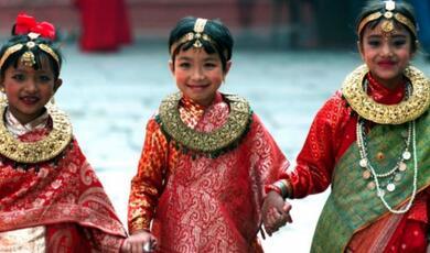 Photograph of Nepalese girls Rashmi Manandhar, Oashin Maharjan and Shriya Shretha arrives for their "first marriage" ceremony in Kathmandu
