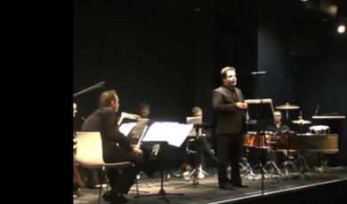 photograph of Thomas Kemp on stage