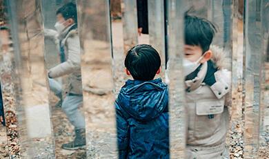 Child in mirror maze