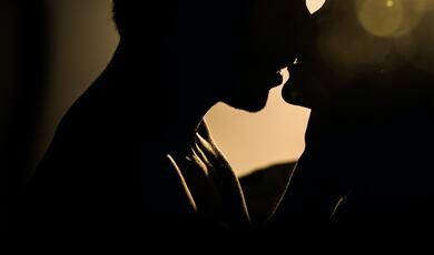 silhouette of couple kissing