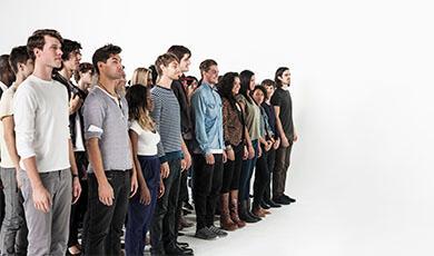 a diverse group of people standing in a line