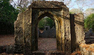 a stone ruined archway at Gede