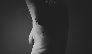 a black and white photograph of the back of a woman