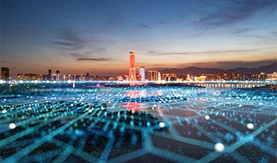 Neon network spreads out towards cityscape at night