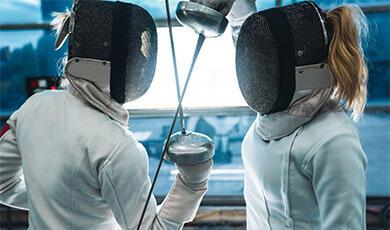 Two fencers with swords touching
