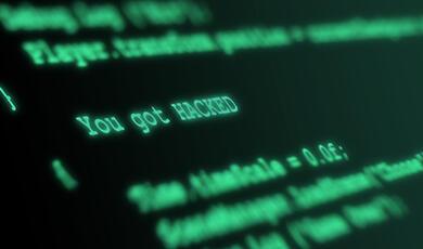green text code on a computer screen with the words 'You got HACKED' visible