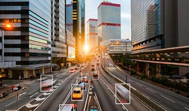 a motorway with boxes around certain cars