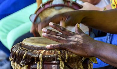 Black hands playing drum
