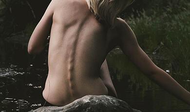 a naked back of a woman