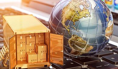 a gold shipping container sitting next to a globe