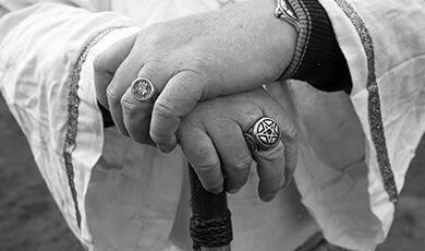 black and white photograph of hands crossed over
