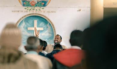 Christian priest speaking