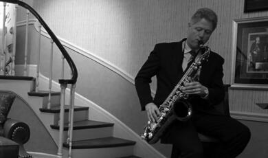 Bill Clinton playing the saxophone