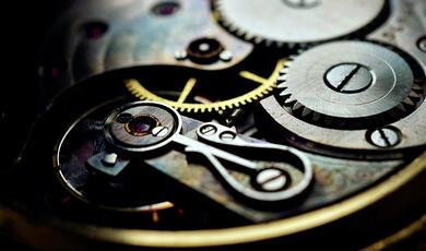 blue and green image, inside mechanism of a clock or watch