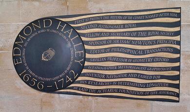 Wall plaque commemorating Edmond Halley in the shape of a comet