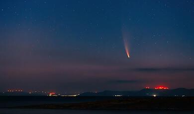 Shooting star in blue evening sky