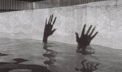 Street art of hands above water