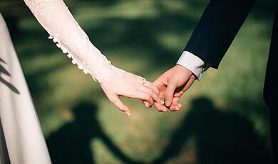 Bride and groom holding hands