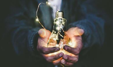 hands holding many lights