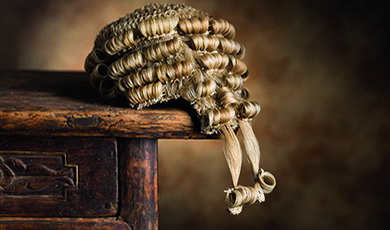 Barrister's wig sitting on old desk